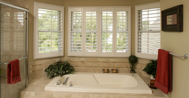 Plantation shutters in Chicago bathroom.